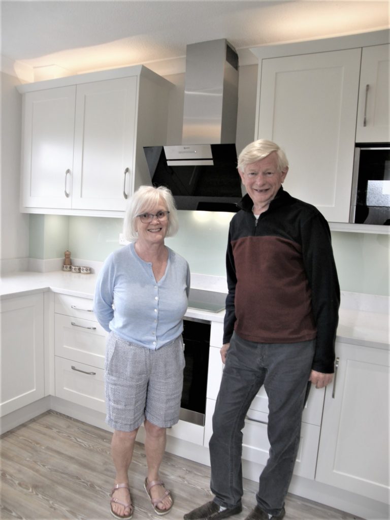 Happy couple in their new kitchen