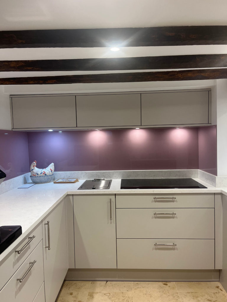 Downlights with pink splashback